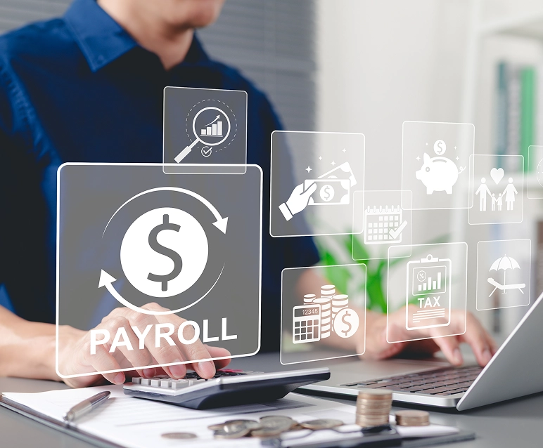 Person using laptop with payroll icons overlay.